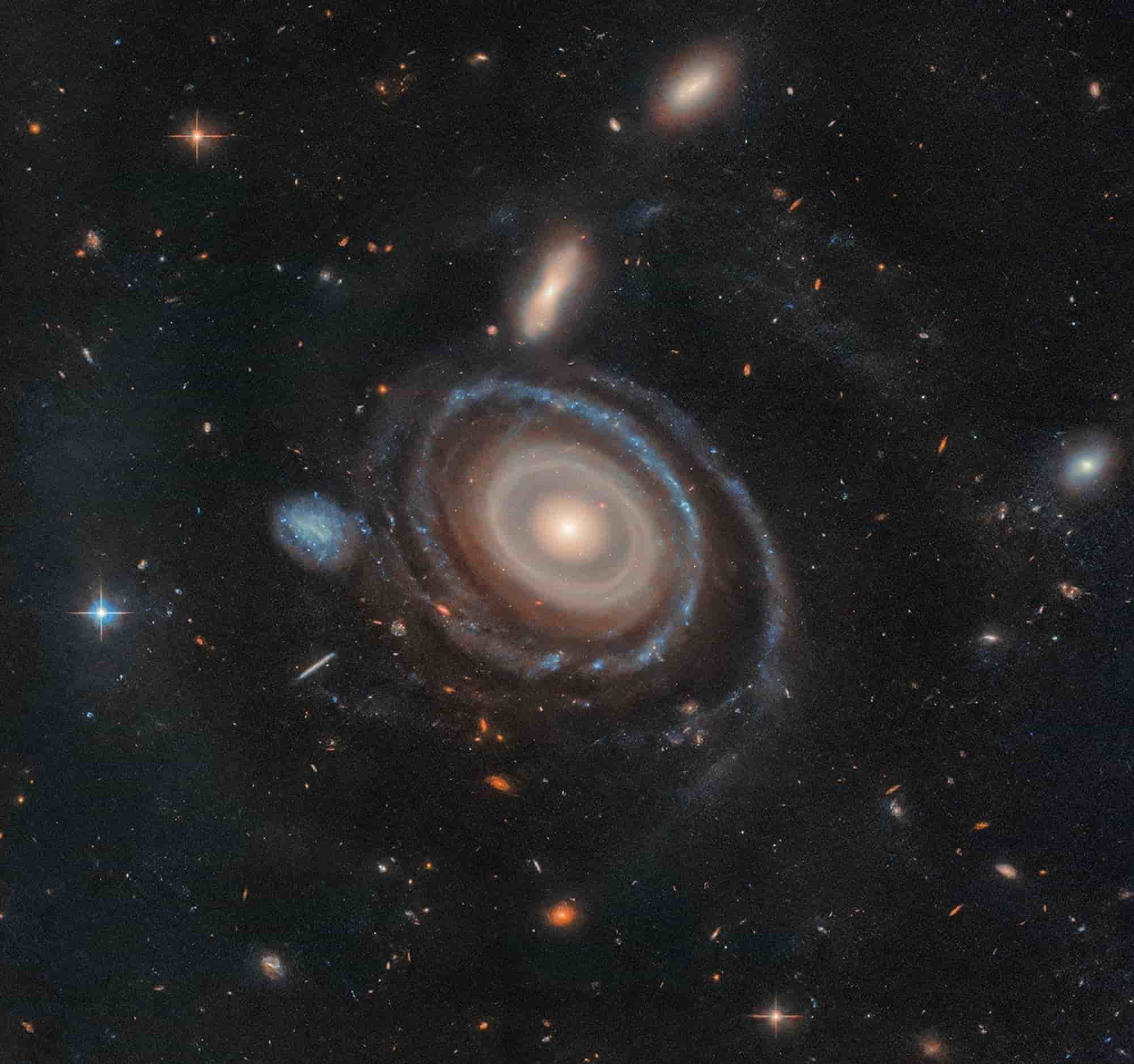 Hubble image of a rare nine-ring galaxy, showcasing its unique cosmic structure and star formation patterns.