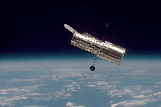 NASA’s Hubble Space Telescope orbiting Earth, capturing deep-space images and advancing astronomical research